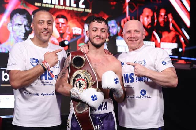Mikey McKinson, centre, with his WBO Global title with father and trainer Michael Ballingall, left, and Gavin Jones. Picture: Mark Robinson/Matchroom Boxing