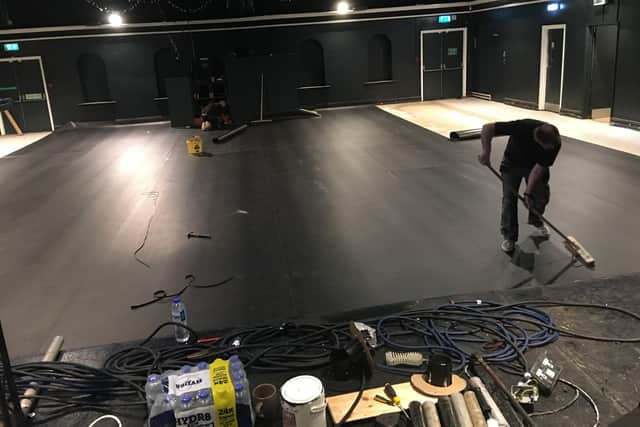 The new floor goes down in the main room of The Wedge.