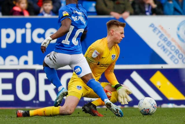 Peterborough's Siriki Dembele (10) is stopped by Alex Bass during Pompey's loss at London Road last week. Picture: Simon Davies