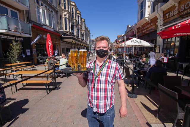Rodney Watson of The Southsea Village holding pints of beer at Palmerston Road. Picture: Habibur Rahman