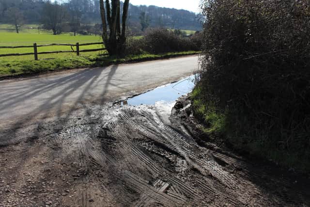 Water collecting in holes in the road residents say were created by heavy machinery. Picture: Emily Turner 