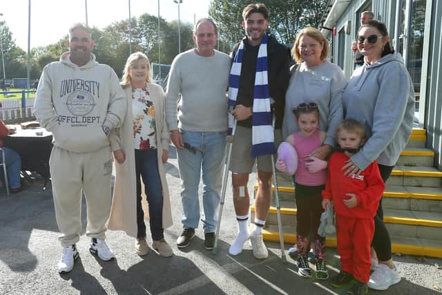 Club captain Charlie Oakwell who broke his leg in two places a fortnight ago pictured with his family at Baffins Milton Rovers FC. The gate receipts from Saturday's game with Sherborne were donated to him to support his immediate family
Picture: Chris Moorhouse (jpns 141023-192)