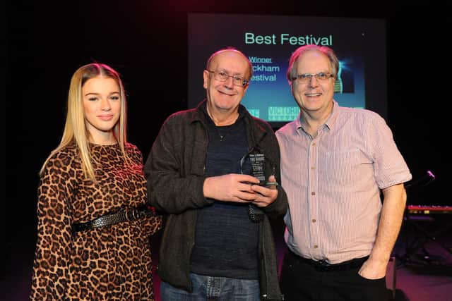 Pictured is: (left to right) News reporter Millie Salked with The Guide Awards Winners of Best Festival Wickham Festival, organiser Peter Chegwyn and Graham Hiley. 

Picture: Sarah Standing (280119-7368)