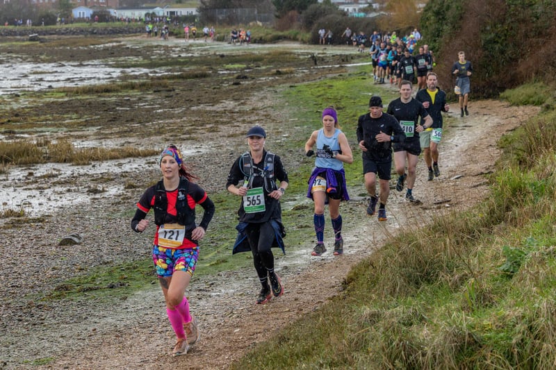 Runners on the shore of Eastney Lake during the Portsmouth Coastal Half Marathon. Picture: Mike Cooter (180224)