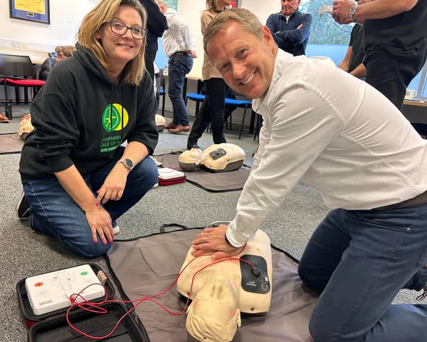 MD Darren Cooper receives CPR training