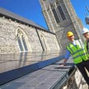 The Rev Neil Smart, Claire Beadnell, and the Rev Adam Tams with the solar panels on the roof of St Jude’s Church, Southsea