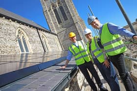 The Rev Neil Smart, Claire Beadnell, and the Rev Adam Tams with the solar panels on the roof of St Jude’s Church, Southsea