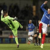 Ronan Curtis challenges Burton keeper Ben Garratt in the middle of the pitch during a Pompey first-half attack. Picture: Daniel Chesterton/phcimages.com