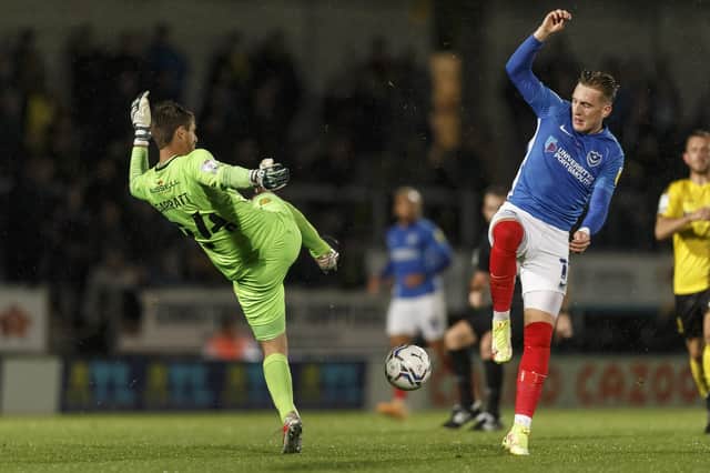 Ronan Curtis challenges Burton keeper Ben Garratt in the middle of the pitch during a Pompey first-half attack. Picture: Daniel Chesterton/phcimages.com