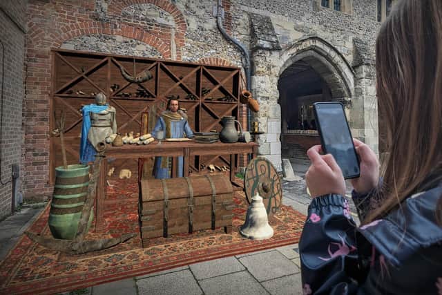 A composite image showing the user experience of the 878AD augmented reality app on the streets of Winchester