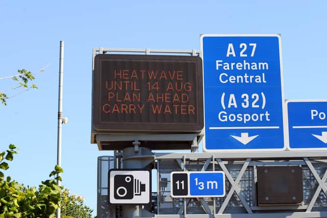 A heatwave warning sign on the M27 motorway near to junction 11 for Fareham and Gosport. Picture: Sarah Standing (110822-8734)