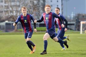 Frankie Paige (middle) has just scored a stunning goal to put US Portsmouth 2-0 up against Millbrook. Pic: Martyn White.