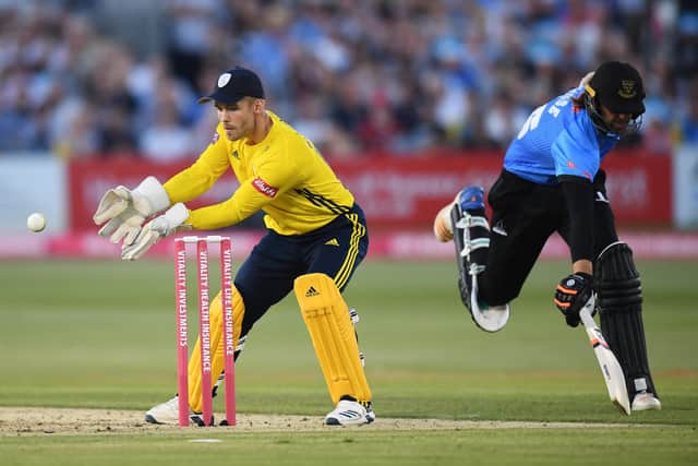 Lewis McManus gathers as Sussex batsman David Wiese makes his ground during a T20 Blast match at Hove last year. Photo by Mike Hewitt/Getty Images.