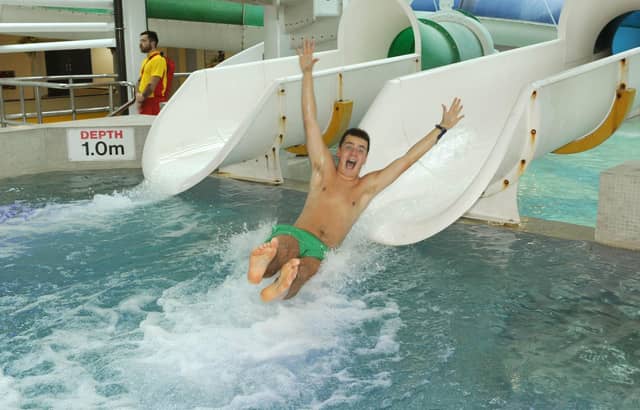 September 2014. The Southsea Pyramids re-opens after extensive refurbishment following the flooding earlier in the year. Student reporter Sam Poole (18) tries out the slide. Picture: Paul Jacobs (142822-56)