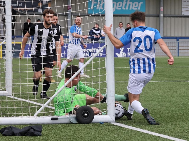 The Emsworth goalkeeper stops the ball crossing the line. Picture by Kevin Shipp