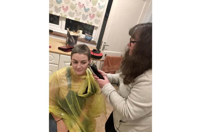Local democracy reporter Fiona Callingham having her head shaved by mum Tracey who works at St Wilfrid's Hospice. Picture: Fiona Callingham