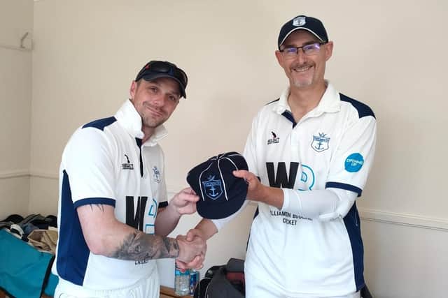 Vice captain Dave Going, left, is presented with a special cap on his 50th Portsmouth Community appearance by chairman Matt Barber.
