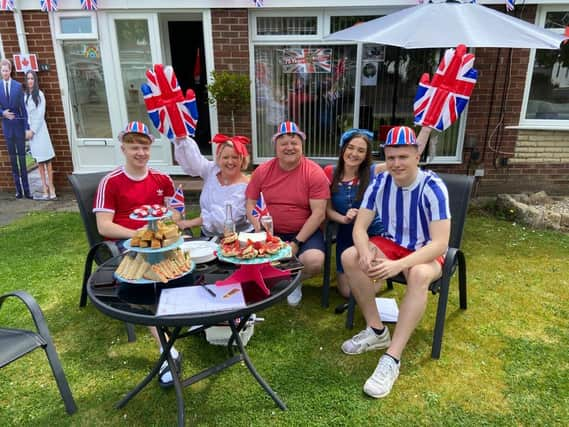 The Mulvaney family in Moorside flying the flag for VE Day. Picture by Frank Reid.