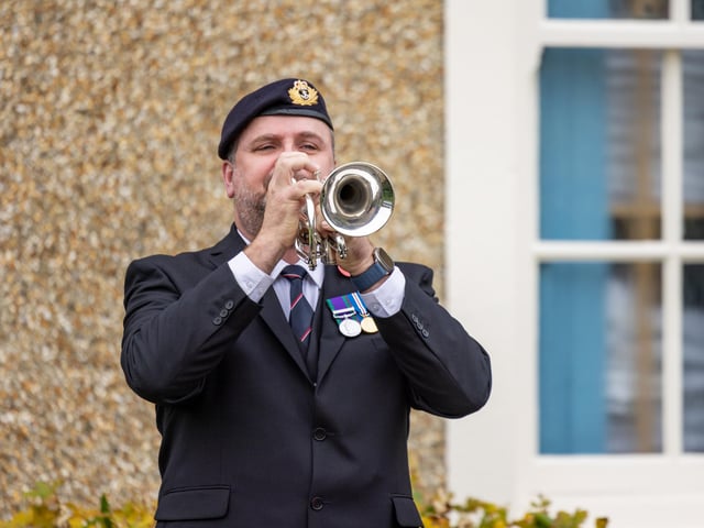 Bugler playing the last post at the service in Gosport. Picture: Mike Cooter (121123)