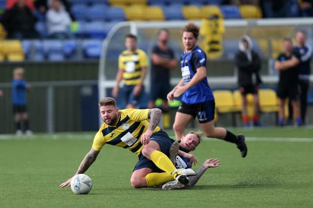 Shane Cornish (yellow/blue) scored twice as Paulsgrove defeated Overton 5-1 in the Hampshire Premier League. Picture: Chris Moorhouse