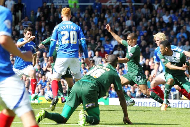 Danny Hollands nets his second of a Fratton Park hat-trick against Plymouth in May 2014. Picture: Joe Pepler