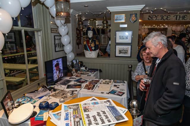Friends of the Jenkins browse the collection of memories at The Jolly Sailor. Picture: Mike Cooter (210122)