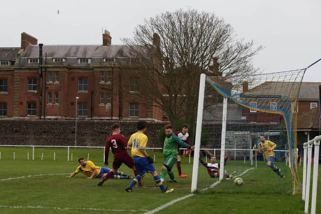 Dale Holmes, left, scores again against Netley. Picture: Andy Nunn