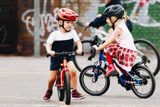 Children learning to ride at Buckland Community Day (26 July, 2025)