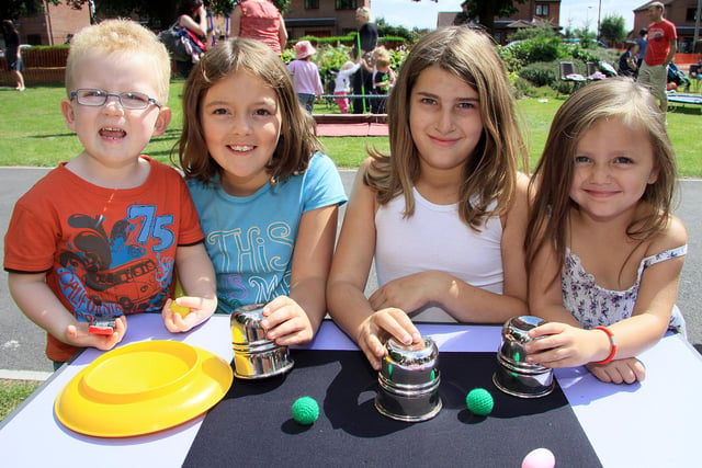 James Selby 2, isobelle Selby 8, Chloe Ash 10 and Rubie Richardson 3 enjoy learning magic tricks at a circus workshop event at Crossley Park, Ripley, in 2010.