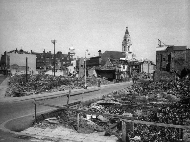 Russell Street and Swan Street. A dramatic view across a blitzed area south of the Guildhall with Russell Street running away from camera at an oblique angle.