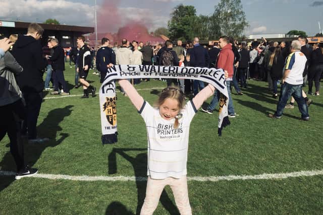 Freya Musty on the pitch at Kingstonian in 2017 celebrating Hawks' promotion.