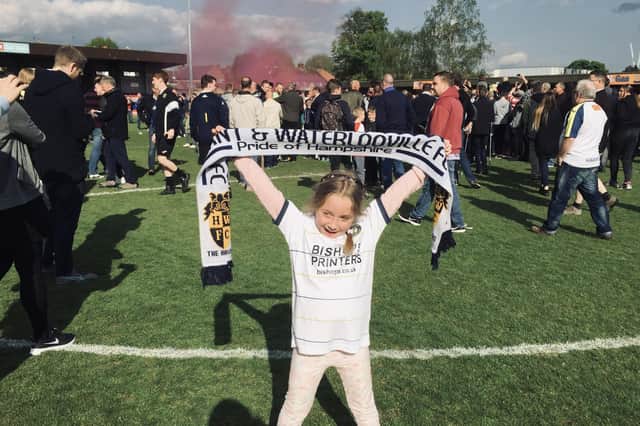 Freya Musty on the pitch at Kingstonian in 2017 celebrating Hawks' promotion.