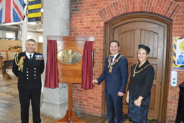 Commodore JJ Bailey, left, with the Lord Mayor and Lady Mayoress of Portsmouth at the unveiling of the new Falklands plaque at Portsmouth Historic Dockyard. Picture: David George