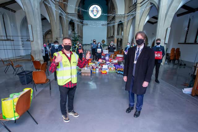 Lay pioneer minister Fran Carabott and Priory School headteacher Stewart Vaughan with Priory School pupils, teachers and volunteers at St Margaret's Food Bank.
Picture: Habibur Rahman