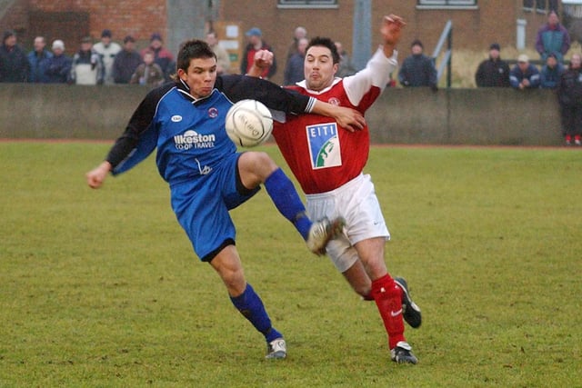 David Jervis (left) tries to clear from a Goole AFC player as the Robins hit the road.