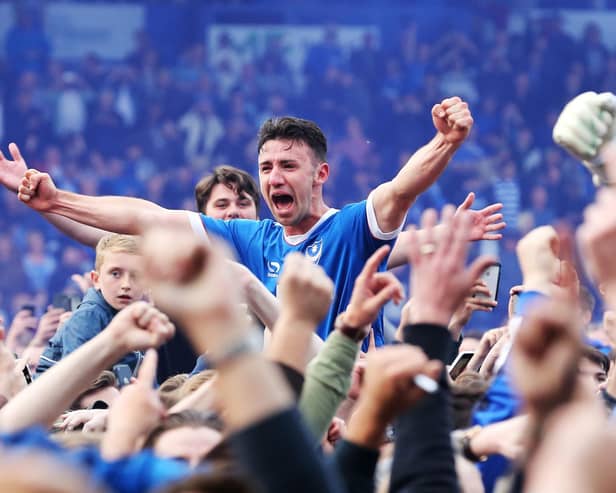 Enda Stevens celebrates winning the League Two title at Fratton Park against Cheltenham in May 2017. Picture: Joe Pepler/Digital South.