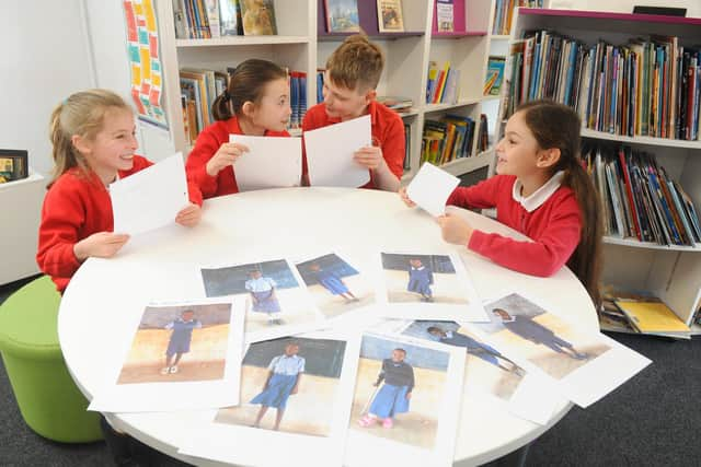 From left, Marryn Burrows (8), Arnie Gransden (10), Adam Norgate (11) and Avril Hanton (9), with letters sent by Kitoo Primary School. Picture: Sarah Standing (160320-7360)