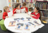 From left, Marryn Burrows (8), Arnie Gransden (10), Adam Norgate (11) and Avril Hanton (9), with letters sent by Kitoo Primary School. Picture: Sarah Standing (160320-7360)