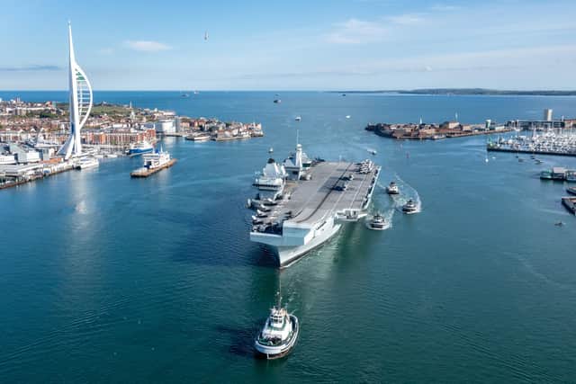 HMS Queen Elizabeth entering Portsmouth with her CSG21 airgroup embarked. Picture: SWNS