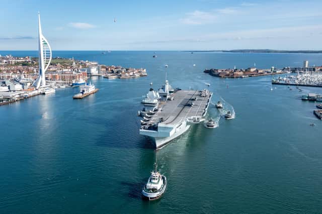 HMS Queen Elizabeth entering Portsmouth with her CSG21 airgroup embarked. Picture: SWNS