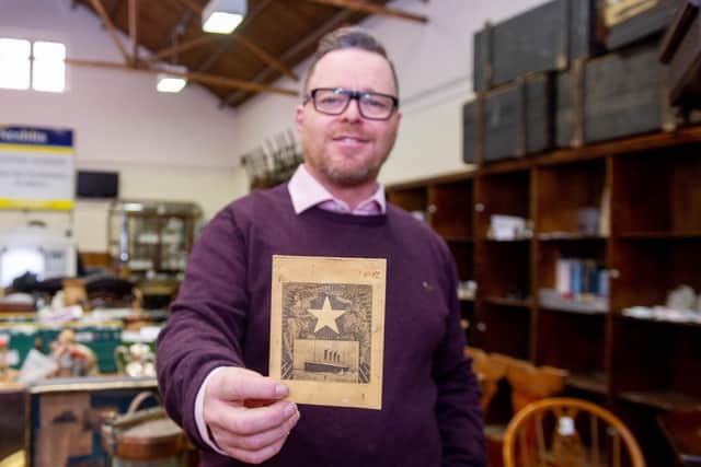 Auctioneer John Cameron with the Titanic menu at Nesbits, Southsea. Picture: Habibur Rahman