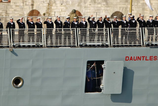 Sailors wave from the Royal Navy Type 45 Destroyer HMS Dauntless as she sets sail from Portsmouth for the Falklands Islands on her maiden deployment. PRESS ASSOCIATION Photo. Picture date: Wednesday April 4, 2012. Scores of well-wishers lined the harbour walls as HMS Dauntless, the second of the navy's hi-tech Type 45 air defence destroyers, left its home port of Portsmouth Naval Base for its maiden mission. See PA story DEFENCE Falklands. Photo credit should read: Chris Ison/PA Wire