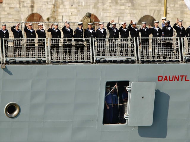 Sailors wave from the Royal Navy Type 45 Destroyer HMS Dauntless as she sets sail from Portsmouth for the Falklands Islands on her maiden deployment. PRESS ASSOCIATION Photo. Picture date: Wednesday April 4, 2012. Scores of well-wishers lined the harbour walls as HMS Dauntless, the second of the navy's hi-tech Type 45 air defence destroyers, left its home port of Portsmouth Naval Base for its maiden mission. See PA story DEFENCE Falklands. Photo credit should read: Chris Ison/PA Wire