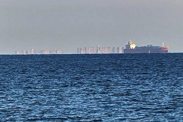 Caption: A mirage of an 'Eastern bloc' city hovering above the Solent has been spotted from Eastney