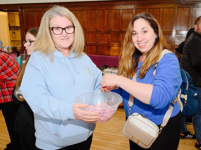 Pictured is: Hayden's nanny, Alison with Steph who helps herself to some numbers in the raffle  Picture: Keith Woodland (290921-42)