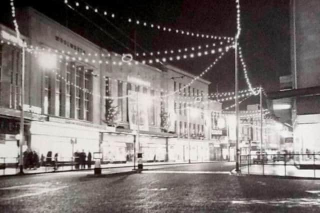Commercial Road after the shops closed. Woolworth’s, Littlewoods and John Collier can be seen. Picture: The News archive
