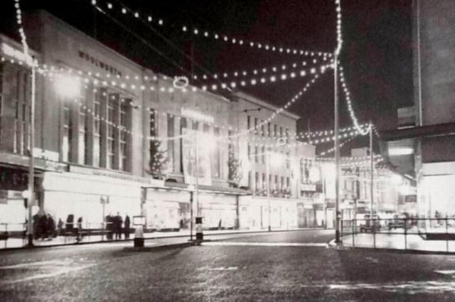 Commercial Road after the shops closed. Woolworth’s, Littlewoods and John Collier can be seen. Picture: The News archive