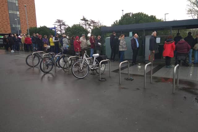 Patients and visitors to Queen Alexandra Hospital in Cosham queue for the multi-storey car parking pay machine