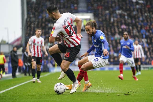 Marcus Harness challenges Bailey Wright in Pompey's 4-0 success. Picture: Jason Brown/ProSportsImages