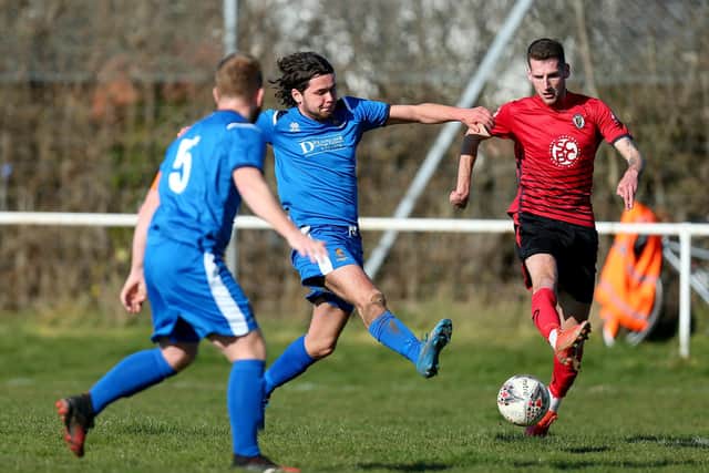 George Caister, centre, was sent off for two bookable offences as Fleetlands won at Whitchurch. Picture: Chris Moorhouse